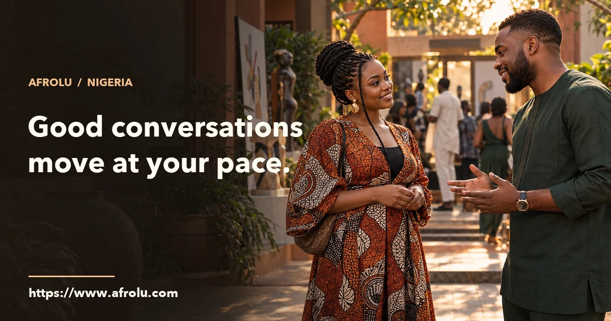 Two Nigerian adults in a public courtyard choosing how to continue a conversation.