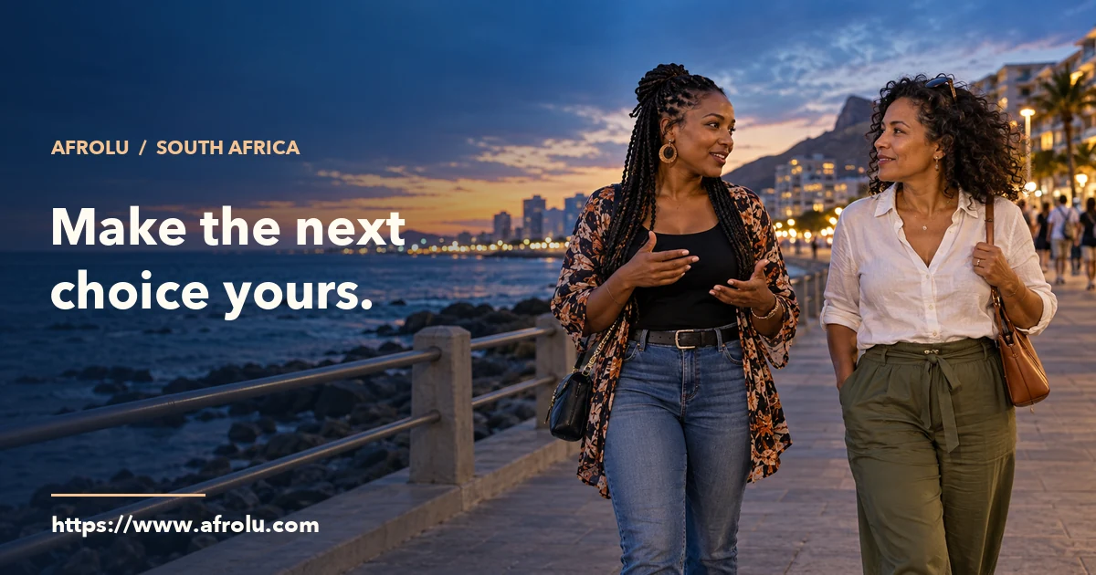 Two South African adults talking as they walk beside a public waterfront.