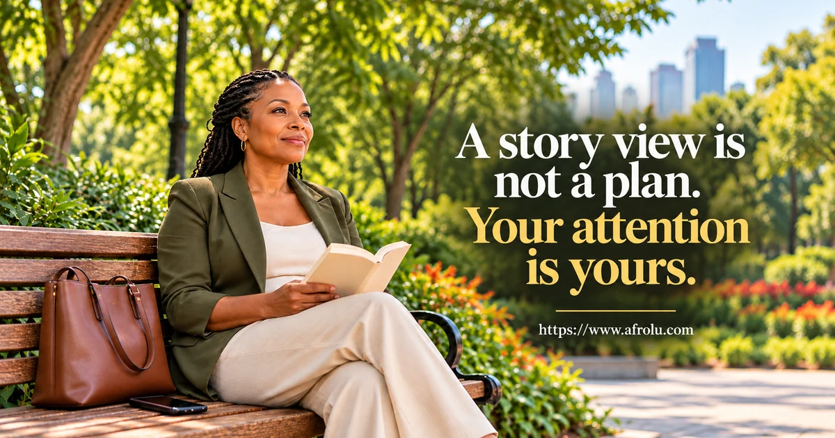 Adult Black woman reads in a city park while her phone rests face down on the bench.