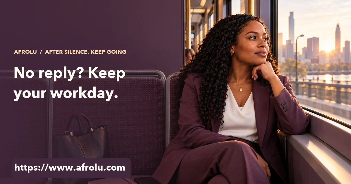 An adult professional looks out of a morning bus window with a closed notebook and phone resting beside her.
