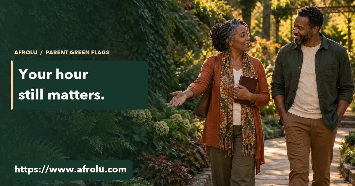 Two adults talk on a garden path as a parent holds a closed planner and the other person listens.