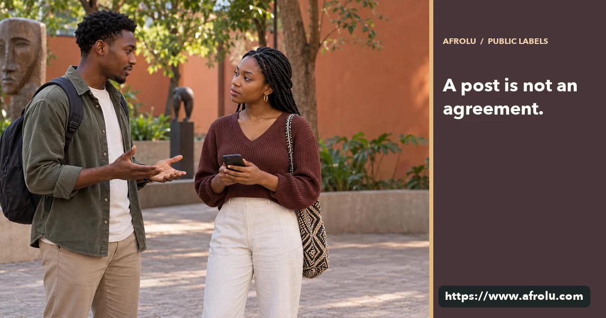 Two adult Black university students discuss a blank phone in a public Nairobi art courtyard.