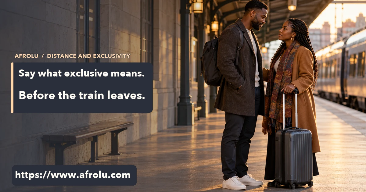 Two adult Black partners talk at a train platform before one leaves with a suitcase.
