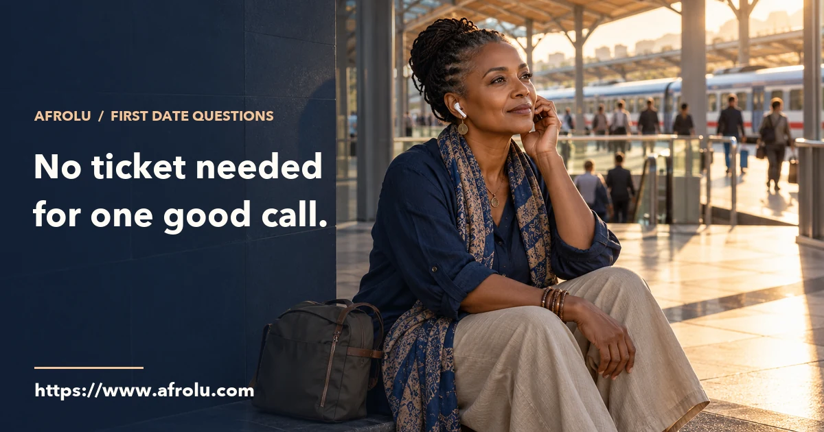 An older adult takes an audio call beside a bag in a busy, open station plaza.