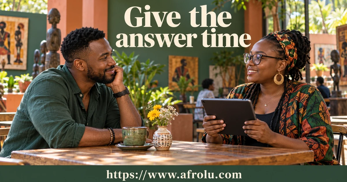 Two adults talk at a table; one holds a tablet.