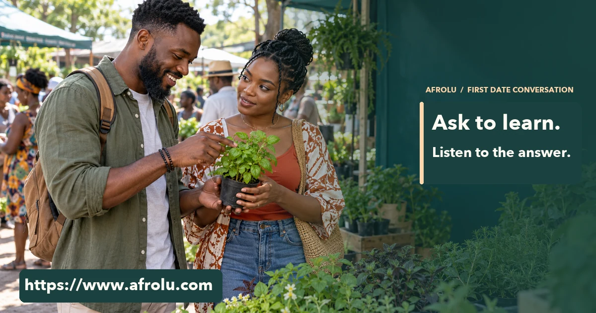 Two adult Black people talk over a small herb plant at a busy open-air weekend market.