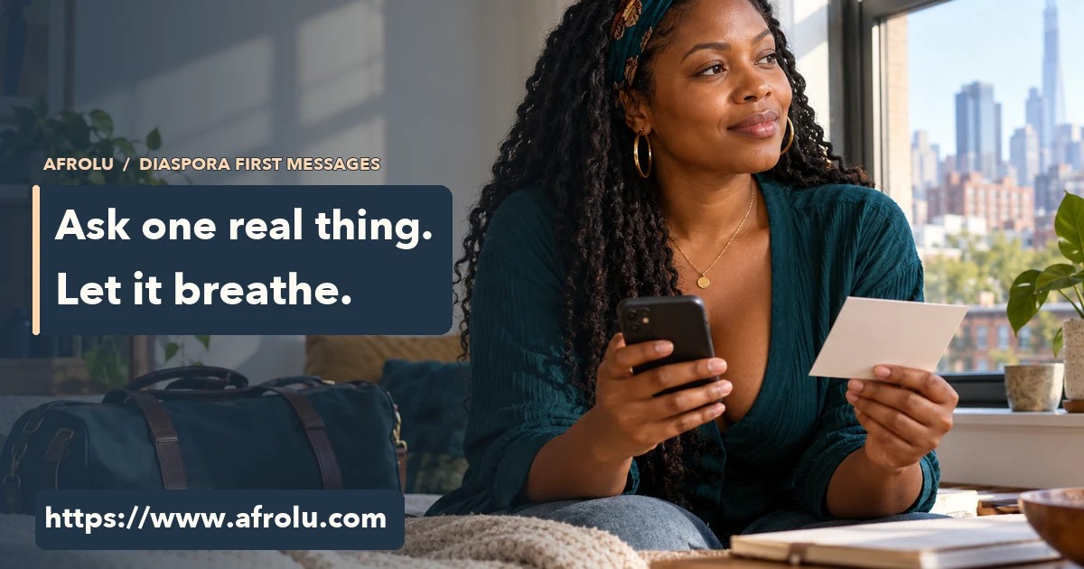 Adult woman by an apartment window holds a phone and card while considering a first message.