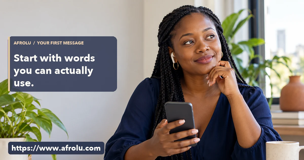 Adult woman listens through an earbud while holding a phone at a bright desk.