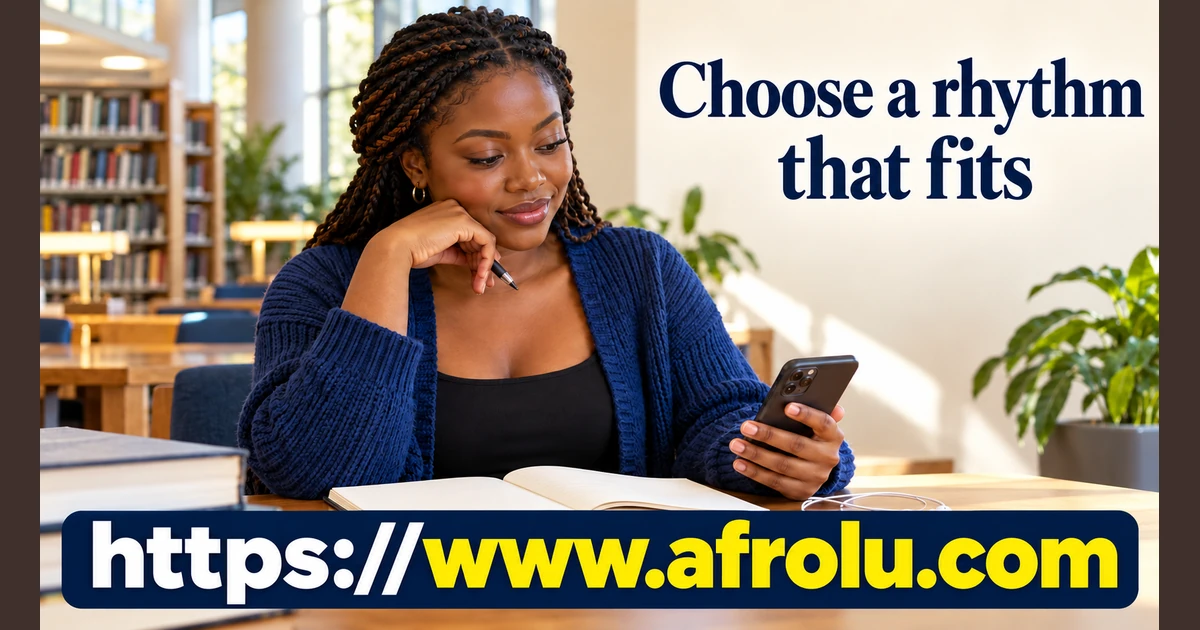A woman sits at a library table with a phone.