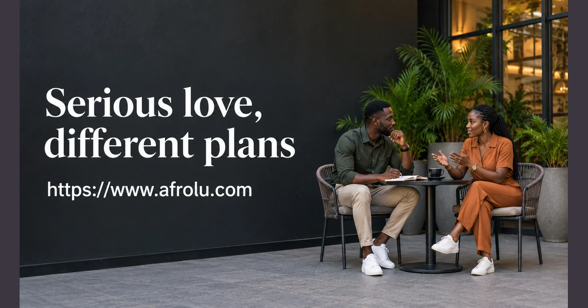 Two adults talk together at a café table.