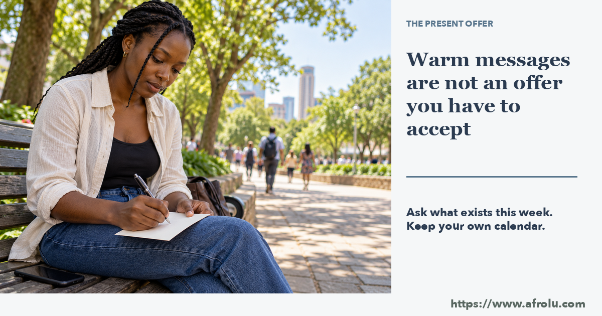 One adult on a public park bench sets a phone face down and writes a date invitation on a blank paper card.