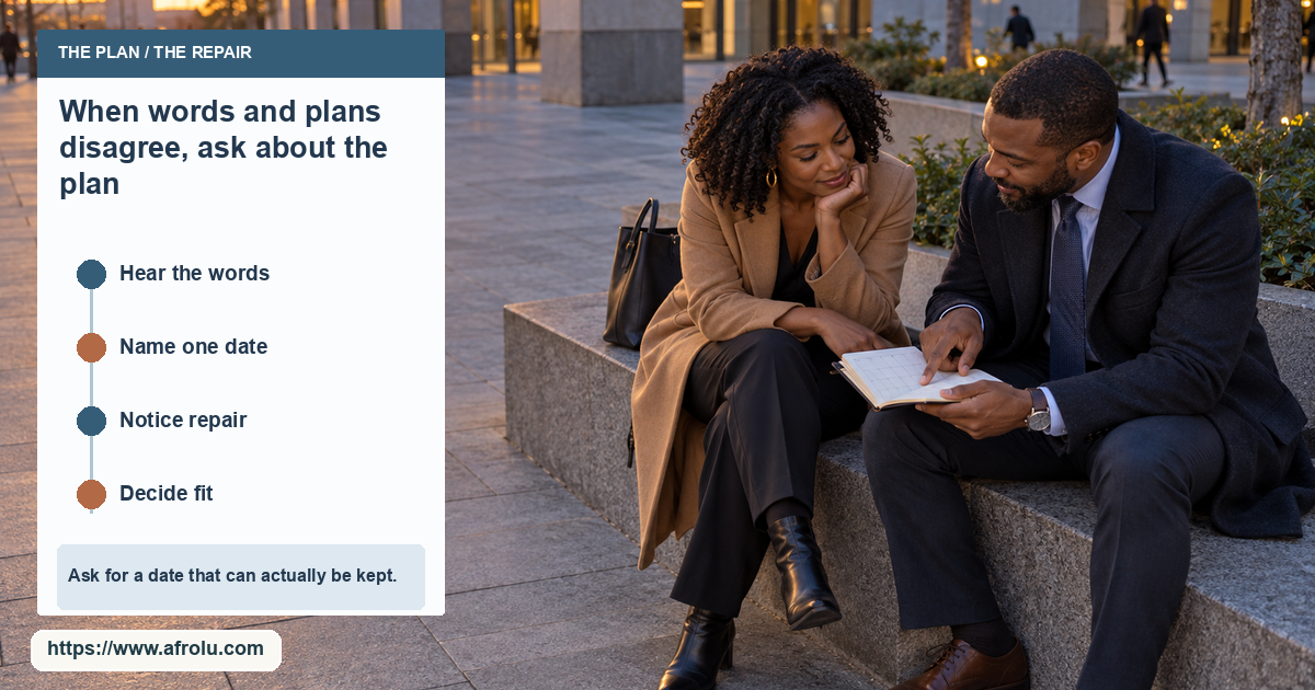 Two adults review a small unmarked paper calendar on a bench outside a city office building.