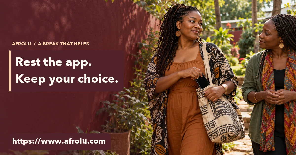An adult woman puts her phone in a cloth bag while walking with a friend in a garden.