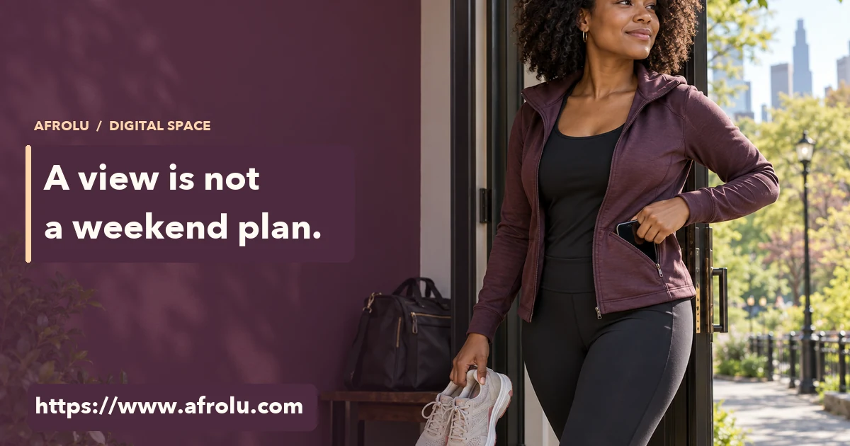 A working adult pockets her phone and picks up walking shoes at the door for a weekend outside.