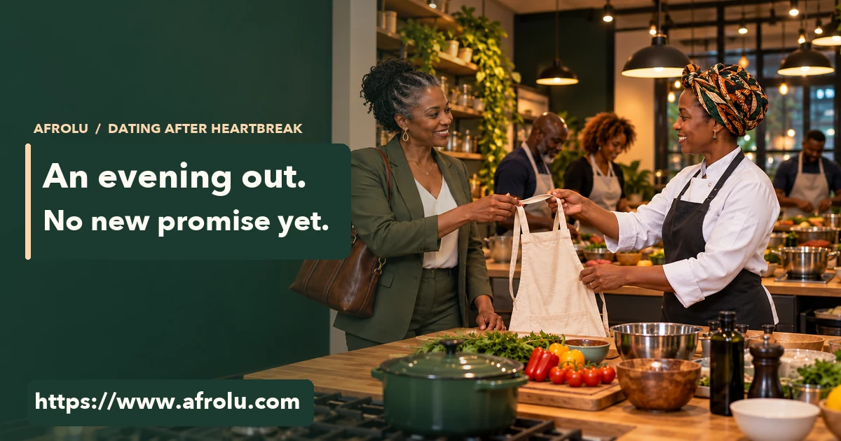 Adult Black woman in her fifties accepts an apron from a smiling cooking instructor at an evening class.