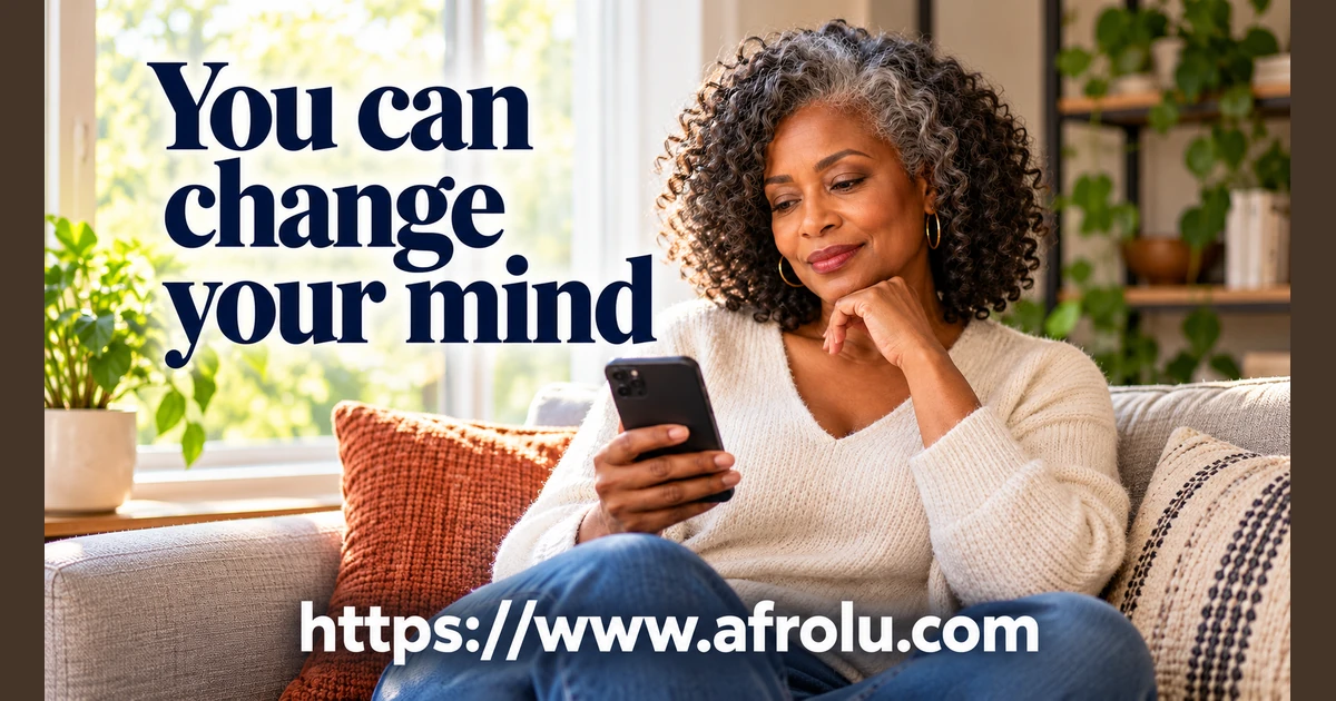 An adult woman considers a message on her phone.