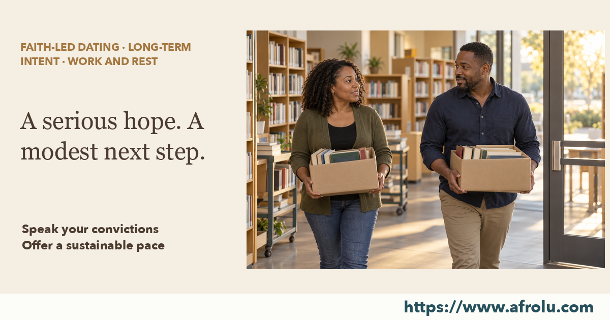 Two adults carrying separate boxes of books talk as they finish a community library volunteer shift.